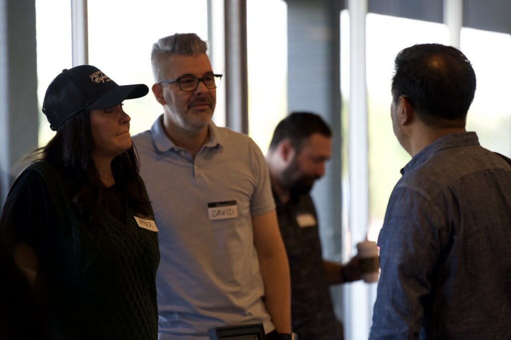 Attendees talking between sessions at the Churchfront Conference