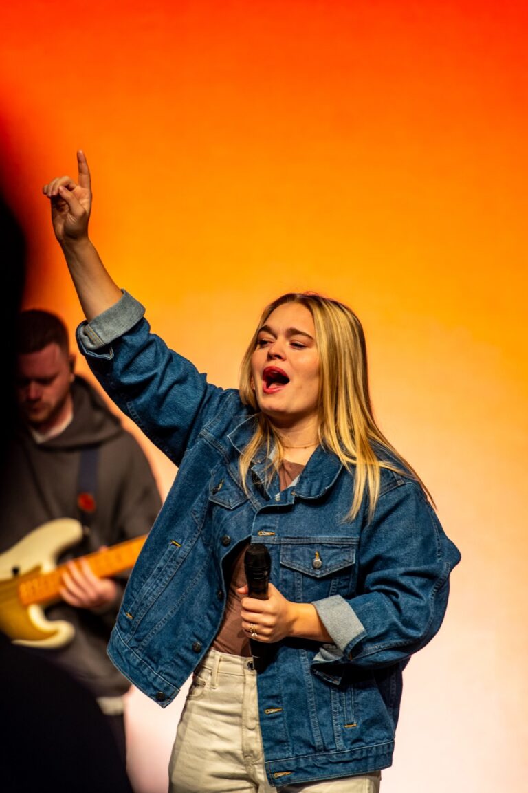 Attendee worshipping during a session at the Churchfront Conference