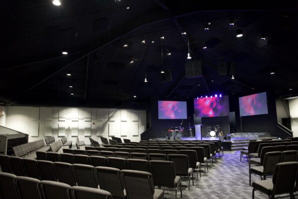 Faith Covenant Church of God worship room from the rear with all three screens