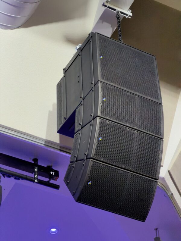 Line array loudspeakers flown above a church platform