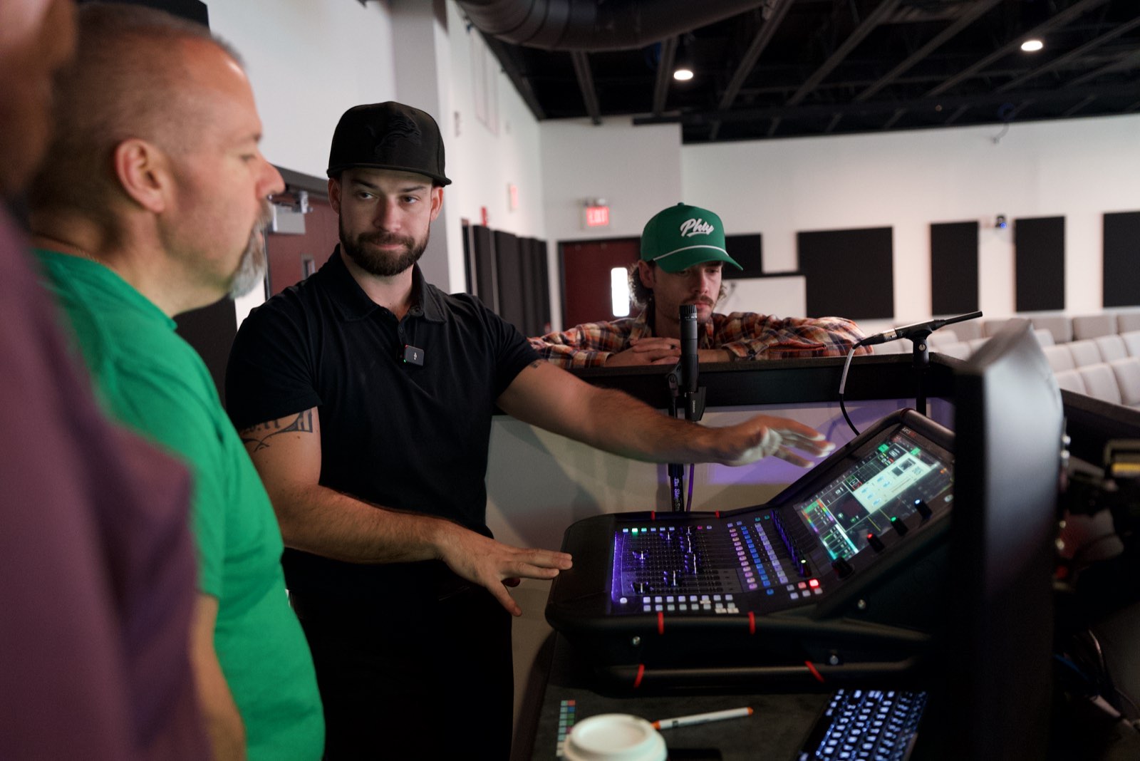 Churchfront engineer training church volunteers on a digital mixing console at Next Community Church