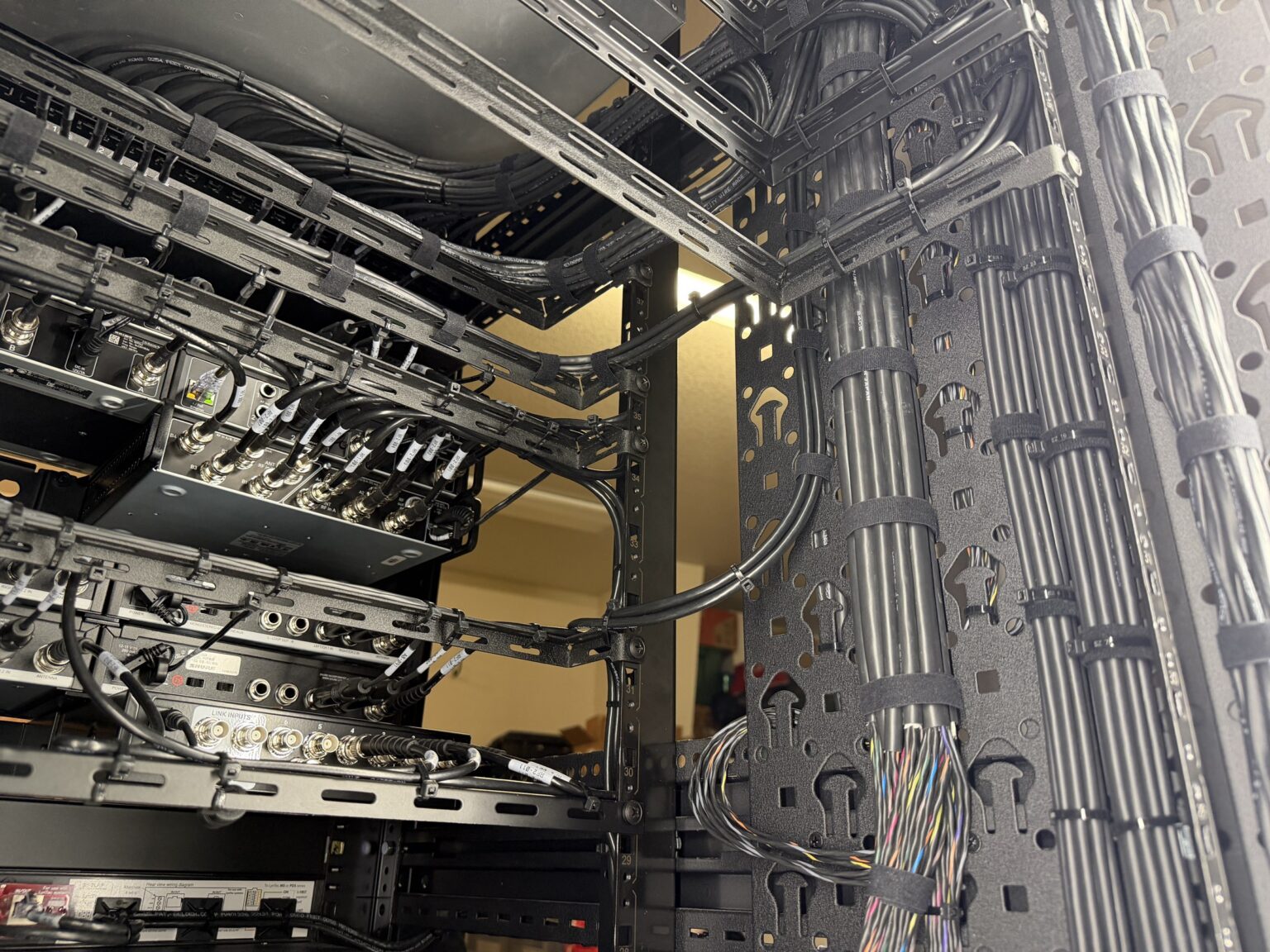 Organized cable infrastructure inside a church AV rack