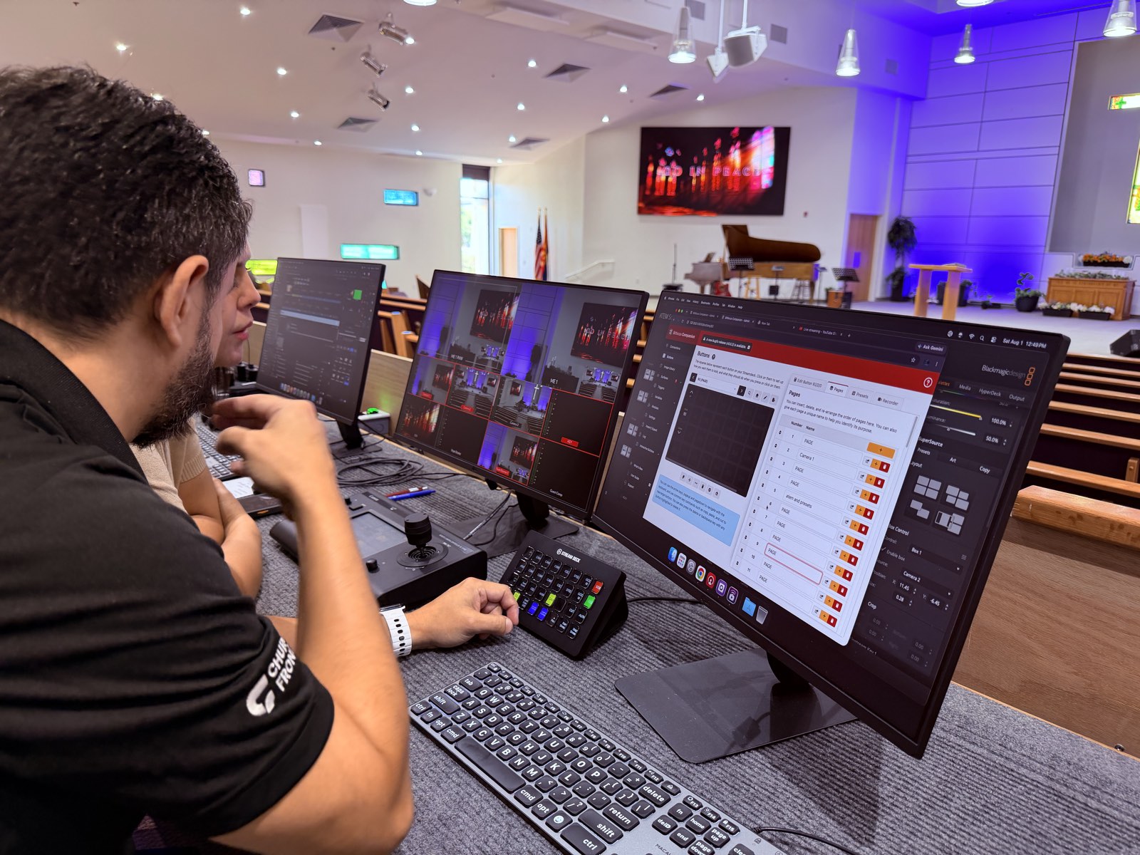 Churchfront team member working with a volunteer at the production desk at Thunderbird Seventh-day Adventist Church